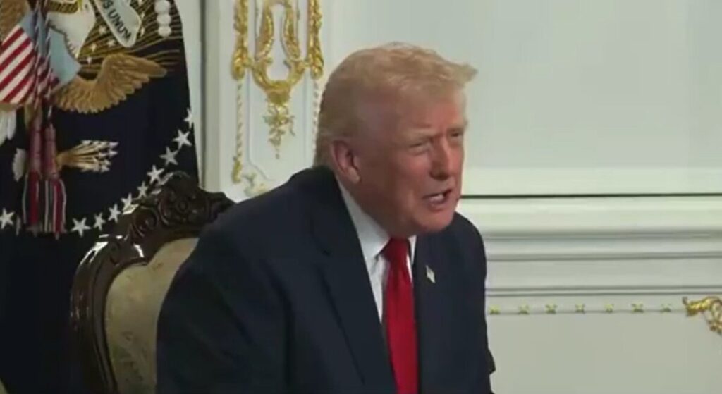 President Trump sitting down speaking