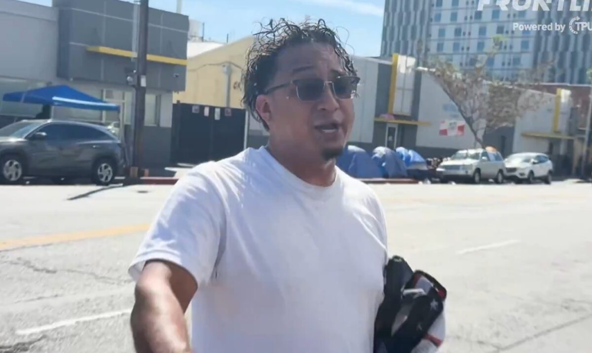 A hispanic-looking man wearing sunglasses