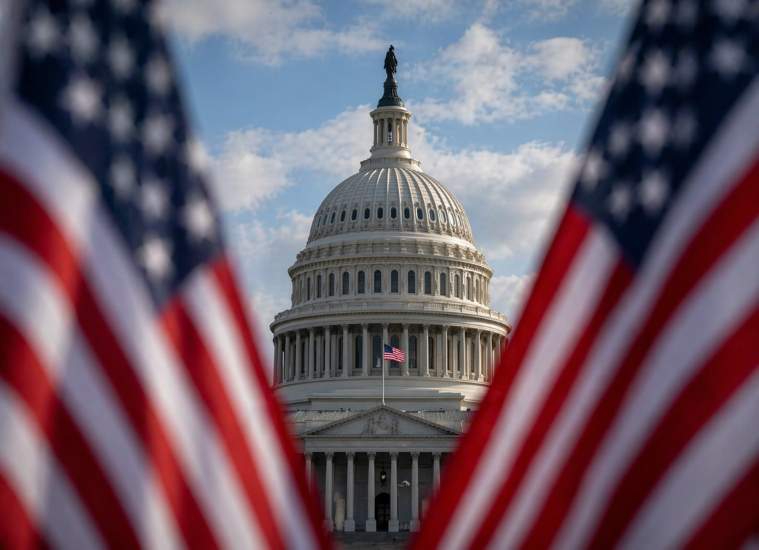 Capital building with American flags in the foreground