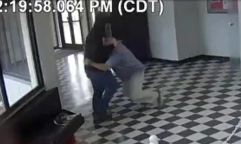 A man tackling another man