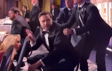 Vice President JD Vance being taken from a table by Secret Service