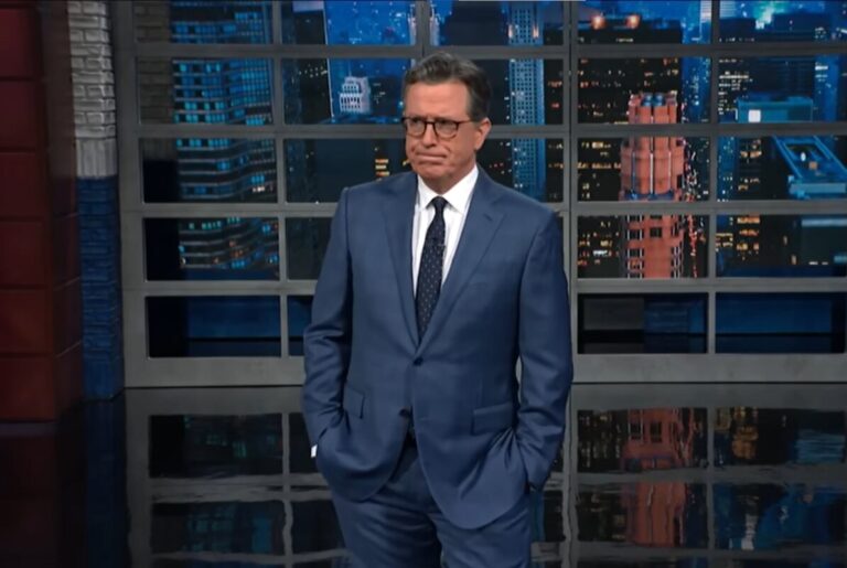 Stephen Colbert standing during The Late Show