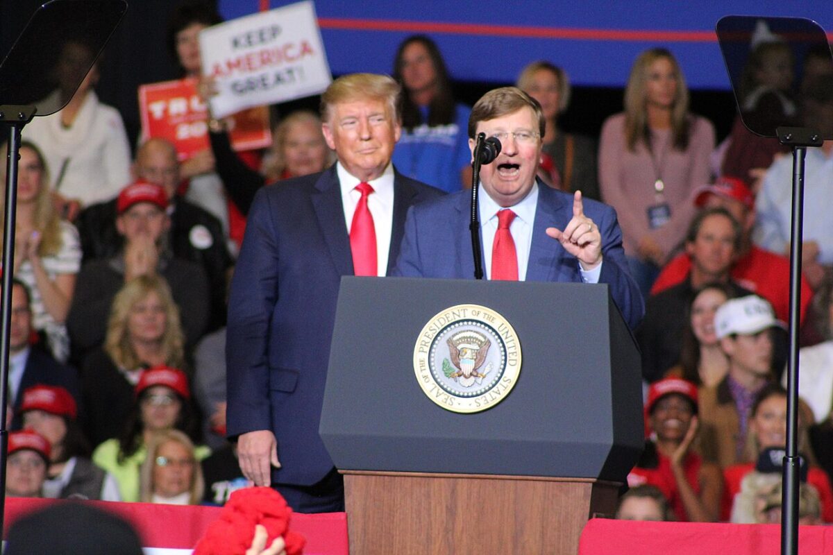 Governor Tate Reeves standing alongside President Trump at a rally