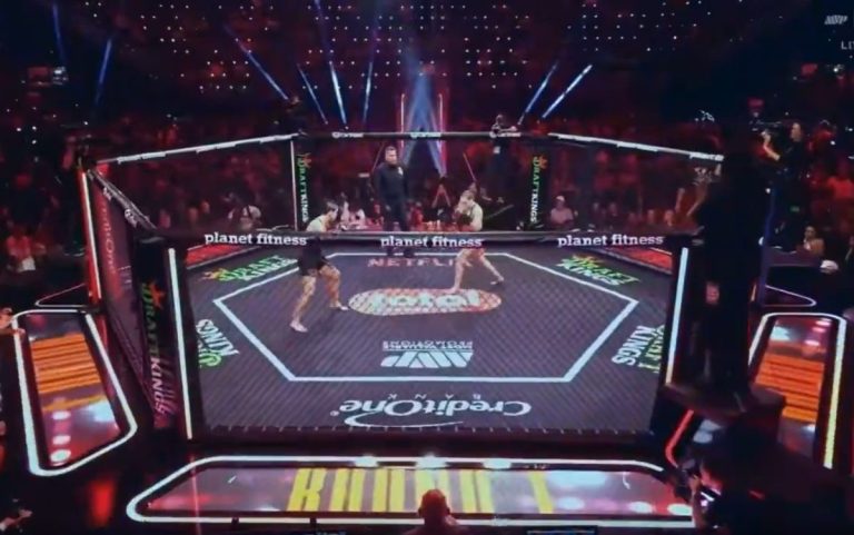 MMA ring with two female fighters