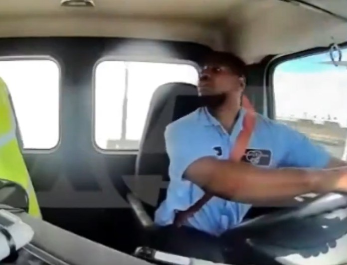 Dashcam view of man driving a truck