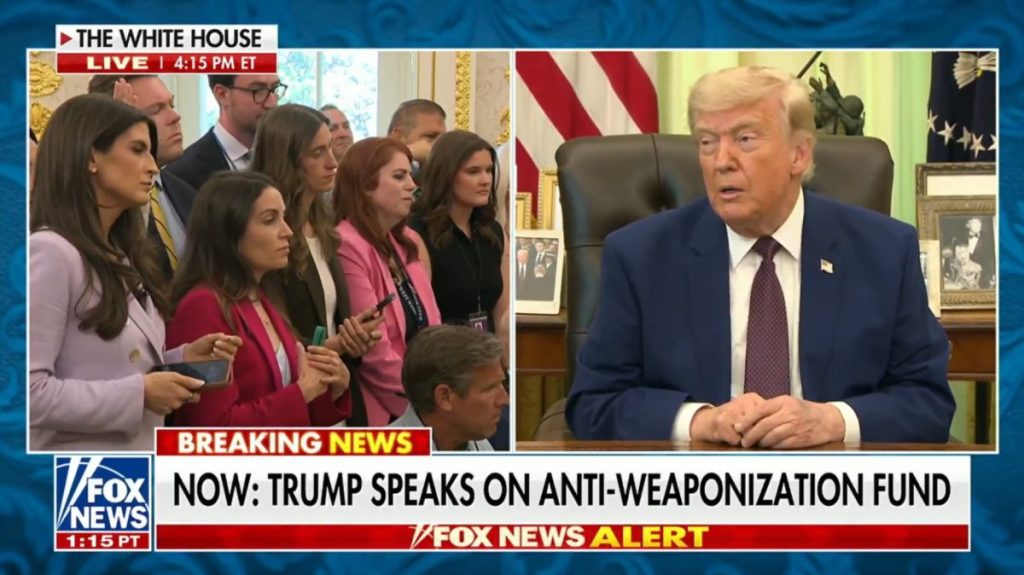 Reporters listening to President Trump speaking