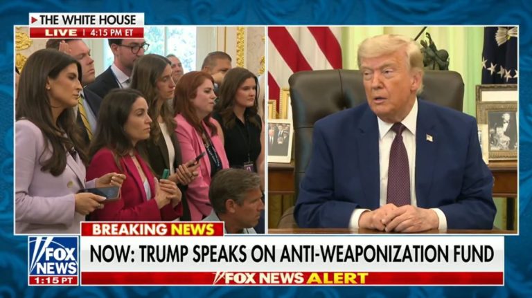 Reporters listening to President Trump speaking